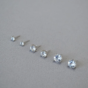 Detailed size range of silver four-prong round cubic zirconia stud earrings