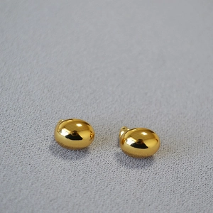 Polished gold bean shaped stud earrings with a glossy mirror finish for women