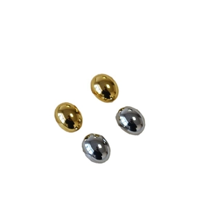 Minimalist oval gold and silver studs with a polished spherical metallic finish