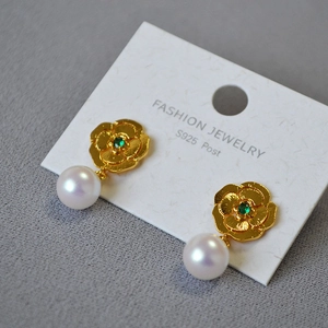 Detail of vintage flower drop earring with green stone, pearl and S925 silver post