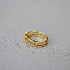Double-layer gold plated brass ring featuring micro-paved cubic zirconia stars