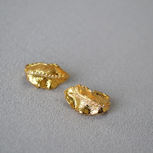 Golden leaf stud earrings with textured finish and cubic zirconia inlay for women