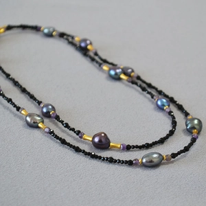 Vintage long necklace featuring black spinel and iridescent baroque pearls for women