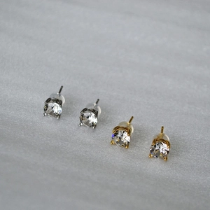 Detailed side view of 925 silver stud earrings with sparkling crystals and silicone backs
