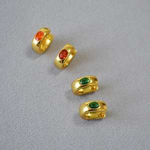 Minimalist gold-plated brass huggie earrings with oval orange and green gemstones