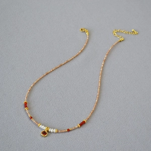 Champagne zircon freshwater pearl beaded necklace with a square red crystal pendant