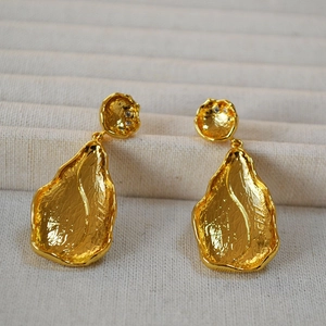 Vintage gold-plated brass leaf earrings with hammered texture and zircon detail