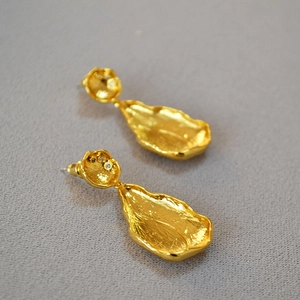 Irregular vintage leaf-shaped gold-plated brass earrings with zircon accents