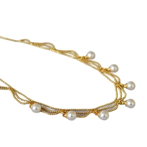 Élégant collier vintage français multicouche en chaîne dorée avec pendentifs en perles blanches