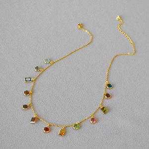 French vintage brass gold necklace featuring 13 vibrant colorful zircon gemstones