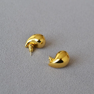 Minimalist hollow water drop gold plated stud earrings with a polished mirror finish