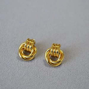 Minimalist double interlocking loop earrings with ribbed top detail in gold finish