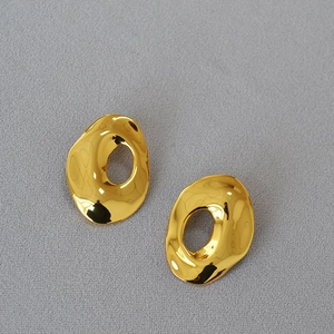 Irregular organic hollow oval gold earrings with high-polished metallic mirror finish