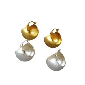 Brushed metal semi-sphere hoop earrings in gold and silver finish on white background