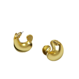 Vintage chunky C-shape hoop earrings with matte gold finish on a white background