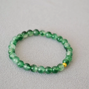 Bracelet extensible en pierres naturelles d'œil de tigre vert avec perle dorée élégante