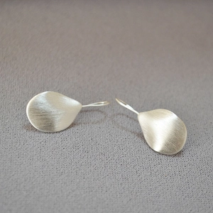 Minimalist brushed silver leaf earrings with textured finish and teardrop design
