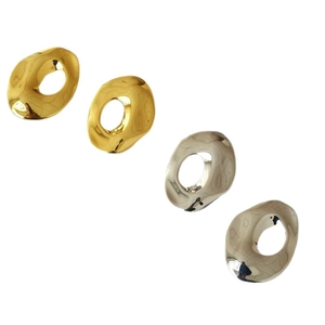Minimalist irregular fluid metal earrings in polished gold and silver finishes