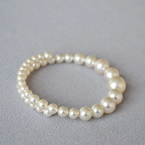 French style double-layer wrap bracelet with gradient ivory faux pearls on grey background