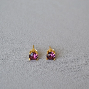 Elegant 925 silver stud earrings featuring round purple crystals in a gold four-claw setting