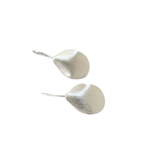 Minimalist silver irregular leaf earrings with brushed metal texture on white background