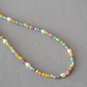 Bohemian style colorful bead and freshwater pearl necklace with gold metal accents