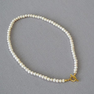 Detailed view of freshwater pearl necklace with gold OT toggle clasp closure