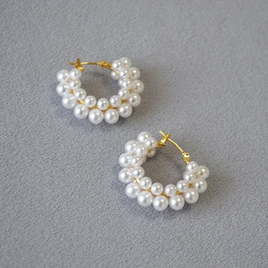 Detailed view of French vintage pearl flower hoop earrings with elegant gold finish