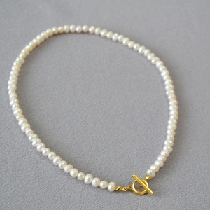 Elegant baroque freshwater pearl necklace with a stylish golden OT toggle clasp