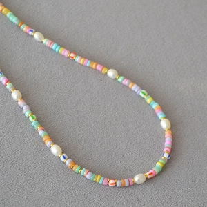 Bohemian colorful beaded pearl necklace with vibrant macaron beads and golden metal spacers