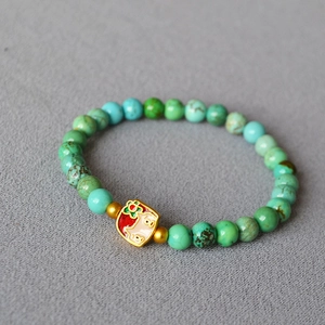 Vintage brass beaded bracelet with turquoise stones and a cat flower enamel pendant