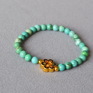 Vintage turquoise beaded bracelet with gold flower and blue enamel floral accents