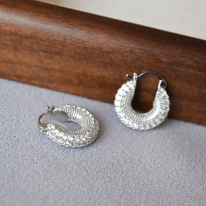 Silver U-shaped chunky hoop earrings with full pave cubic zirconia in high gloss finish
