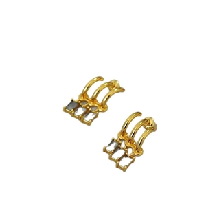 Elegant gold three-layer curved earrings featuring three rectangular grey zircon stones