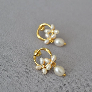 Elegant 925 silver needle pearl flower drop earrings with a golden finish and crystal accents