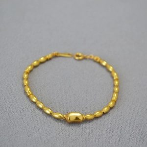 Baroque style gold plated brass pearl necklace with oval beads and toggle clasp