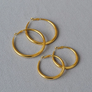 Gold polished hoop earrings set in large and medium sizes with minimalist circular design
