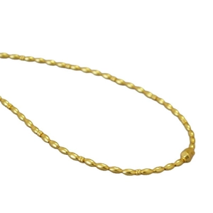Vintage gold plated brass necklace with olive shaped beads on a clean white backdrop