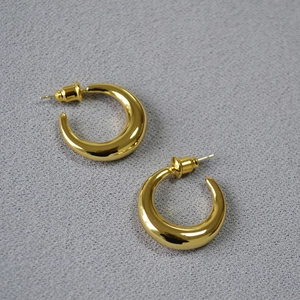 Polished gold crescent hoop earrings with a minimalist C-shaped thick round design