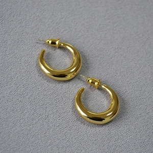 Minimalist gold plated brass crescent hoop earrings with a polished finish for women