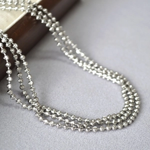 Detail of silver beaded chain with diamond-cut facets for a sparkling finish