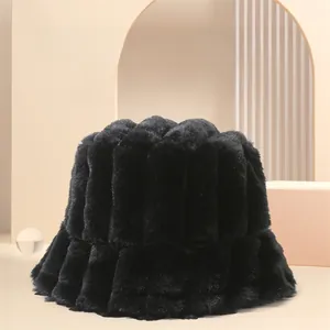 Detailed close-up of a black faux fur bucket hat with warm vertical striped texture