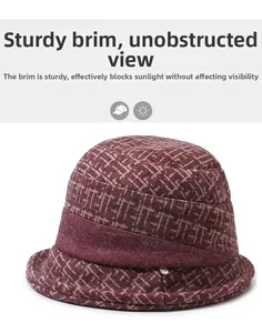 Detail of a dark red winter hat for elderly women showing knitting patterns and brim