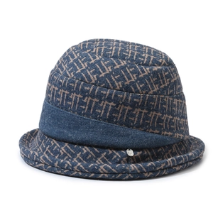 Navy blue winter bucket hat for elderly women with brown geometric jacquard pattern and metal tag