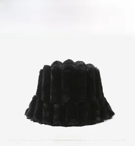 Detail view of black faux fur bucket hat featuring vertical ribbed texture for winter warmth