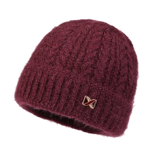 Detailed close-up of wine red knit hat texture and decorative gold metal ribbon logo