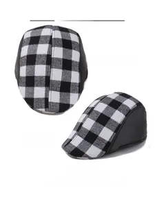 Top and side view of classic black and white buffalo check newsboy cap with leather trim