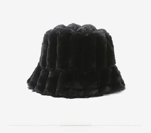 Detail view of black faux fur bucket hat featuring thick ribbed vertical quilted textures