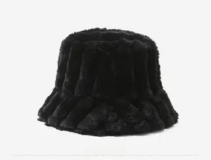 Side view detail of black plush bucket hat featuring a vertical striped faux fur texture