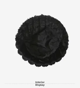 Detailed interior view showing thick thermal lining of the black plush bucket hat